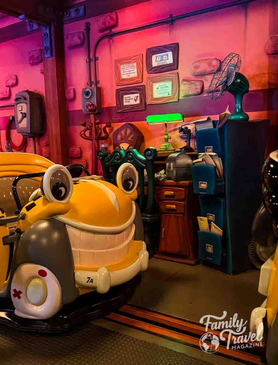 A whimsical yellow cartoon cab ride vehicle in Roger Rabbits Car Toon Spin at Disneylands Toontown.