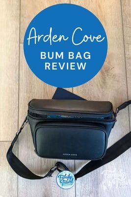 A black Arden Cove bag sits on a light wood floor with text overlay reading Arden Cove BUM BAG REVIEW.
